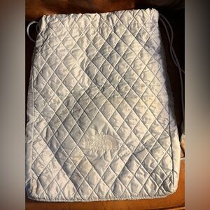 The North Face Drawstring backpack. New. No tags   Pale blue